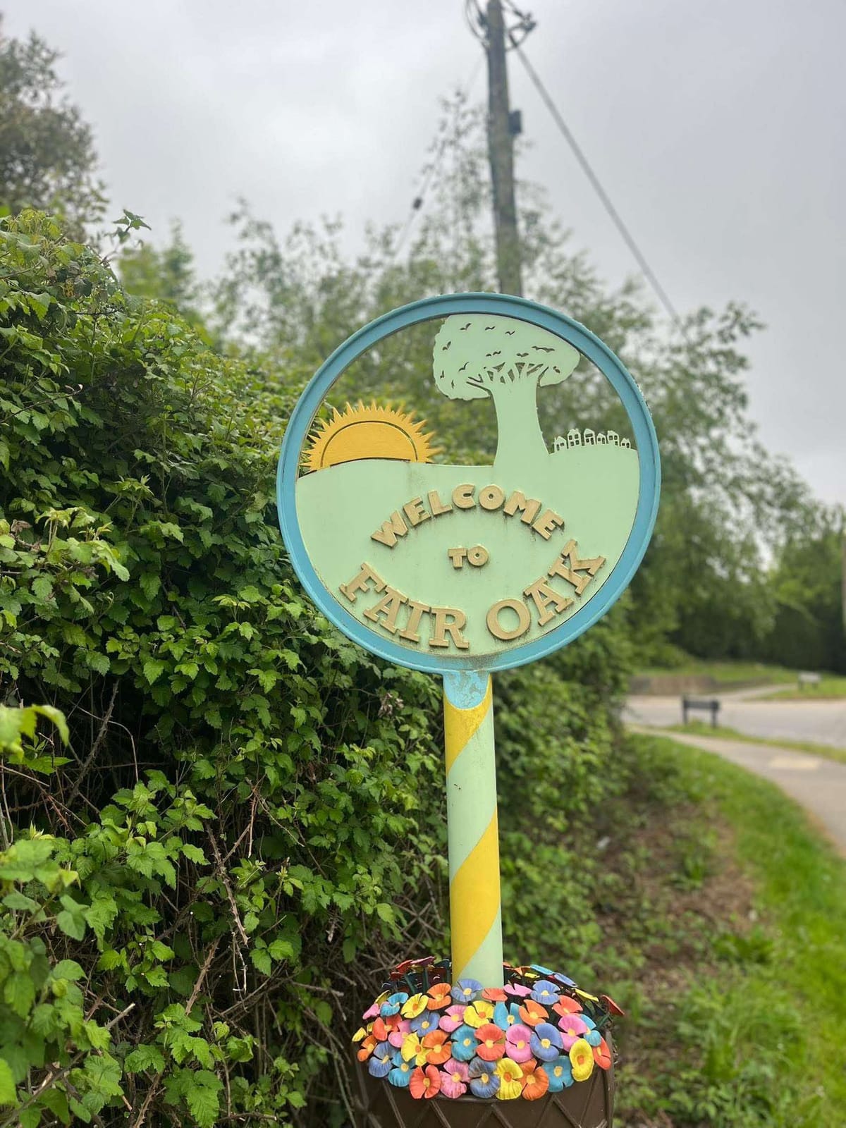 Welcome to Fair Oak village sign on the edge of the village